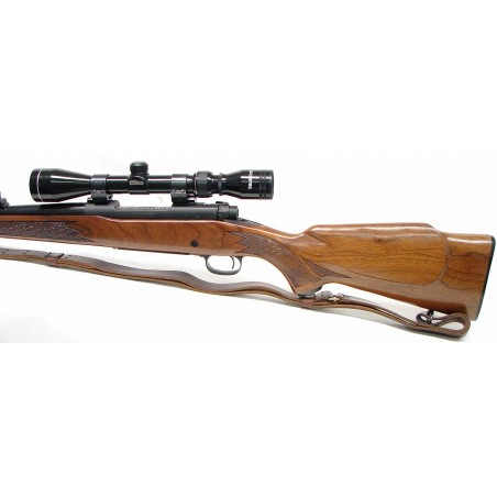 Winchester 70 .243 WIN caliber rifle. Post '64 model with iron sights and Tasco 3x9 scope. Excellent condition (W5751)