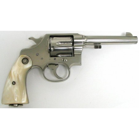 Colt New Service .45 LC caliber revolver. Factory nickel 93% finish. Factory medallion and pearl grips. (c2404)