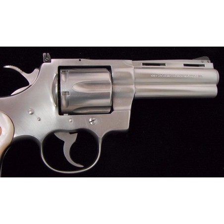 Colt Python .357 magnum caliber revolver. 4 stainless steel model with genuine pearl grips. Excellent condition. (c7283)