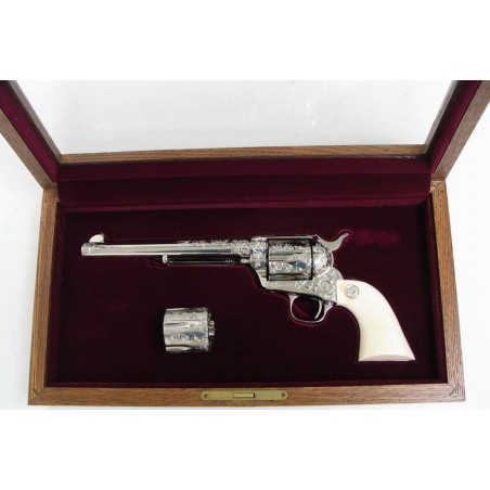 Colt Single Action .45 LC caliber revolver with .45 ACP cylinder. Factory B engraved with ivory grips and presentation case. A (c2395)