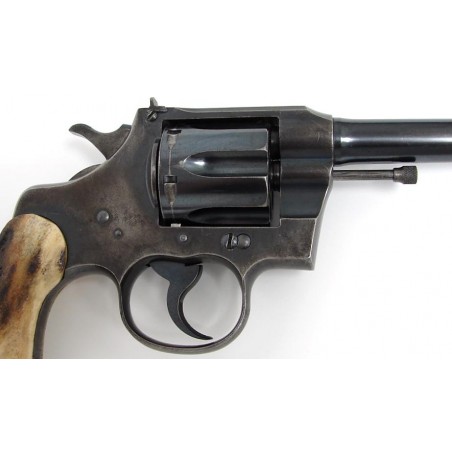 Colt Officers Model .38 Special caliber revolver. Pre-war target model with custom stag grips. Shows some wear, but still locks  (c3590)