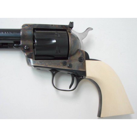 Colt New Frontier Single Action Army .45 LC caliber revolver. 4 3/4 2nd generation model with custom genuine ivory grips. Excel (c7341)