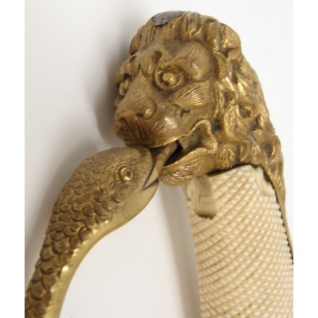 British Georgian Period Lions Head Saber with blue and gilt blade and checkered ivory handle. The guard is in the format of a se (sw840)