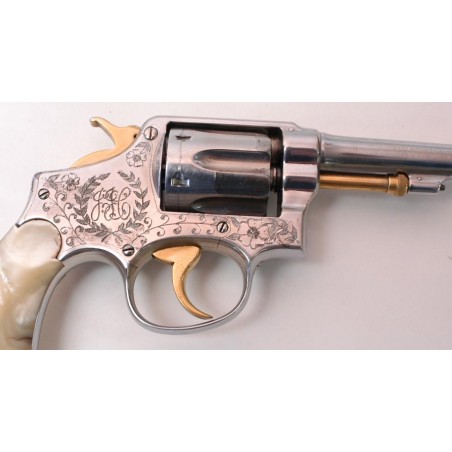 Smith & Wesson Military & Police 38 Special caliber revolver with pearl grips. Appears to be engraved by Wolf & Klar of Ft Worth (pr3102)