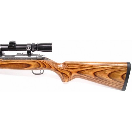 Ruger 77/22 .22 WMR caliber rifle. Varmint model with stainless heavy barrel and laminated stock. Excellent condition with Leupo (r6247)