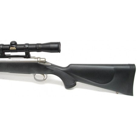 Remington 700 .223 Rem caliber rifle. Stainless BDL model with Redfield 3 x 12 Illuminator 30mm scope. Excellent condition. (r5445)