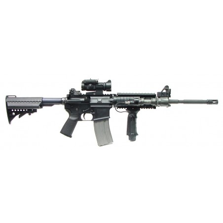Colt Law Enforcement 5.56mm caliber rifle. Decked out M4 type carbine with quad rail, Surfire light, Aimpoint sight and Vltor st (r11412)